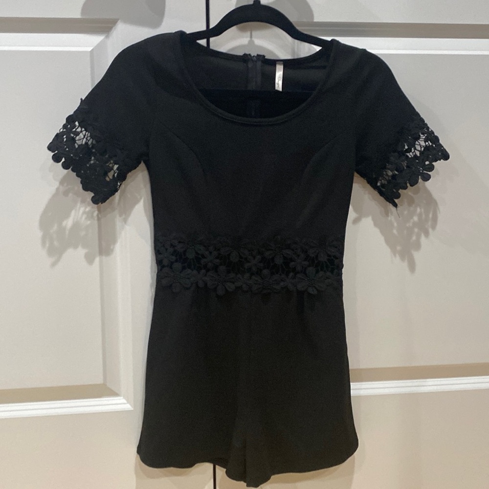 Black romper with knit mid section and sleeves